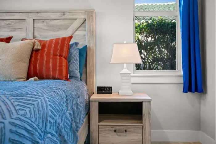Bedroom Retreat: Bright pillows and natural light create a vibrant, restful escape on Marco Island!