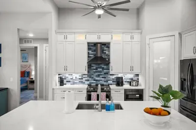 Gourmet Kitchen: Whip up culinary delights in a sleek, modern space with vibrant accents!