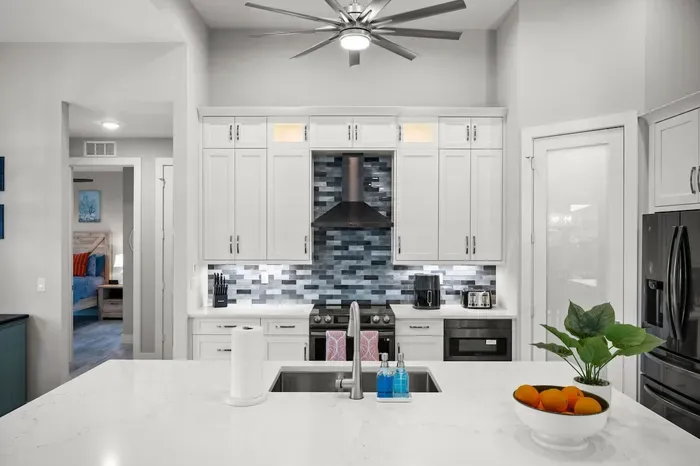 Gourmet Kitchen: Whip up culinary delights in a sleek, modern space with vibrant accents!