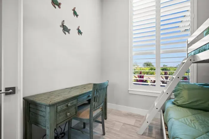 Bunk Room: Bright decor and a fun bunk bed, perfect for kids' adventures in sunny Marco Island!