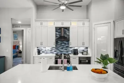 Gourmet Kitchen: Whip up culinary delights in a sleek, modern space with vibrant accents!