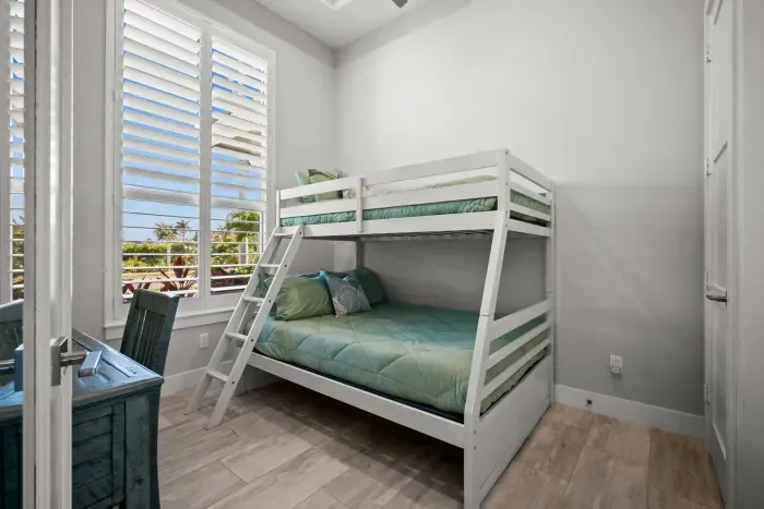 Bunk Room: Fun-filled adventures await in this bright room with tropical views and playful decor!