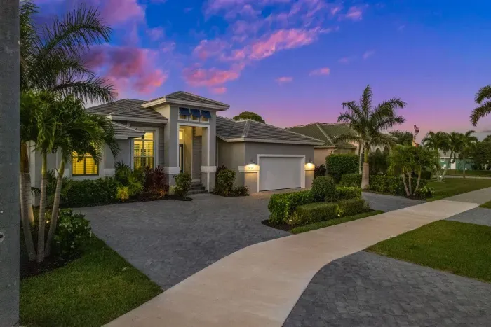 Exterior: Discover a stunning façade with vibrant sunsets and lush landscaping inviting your stay!