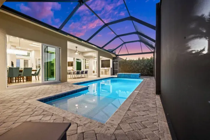 Outdoor Oasis: Dive into luxury with a stunning pool and vibrant sunset views!
