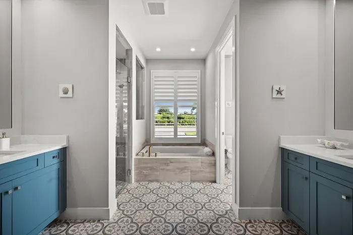 Luxury Bathroom: Bright and airy retreat with stunning views and chic coastal decor!