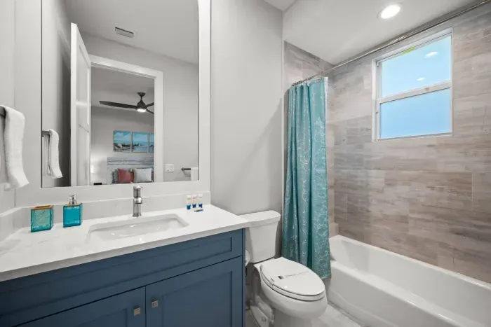 Bathroom Oasis: Bright and airy retreat with modern finishes and soothing ocean hues!