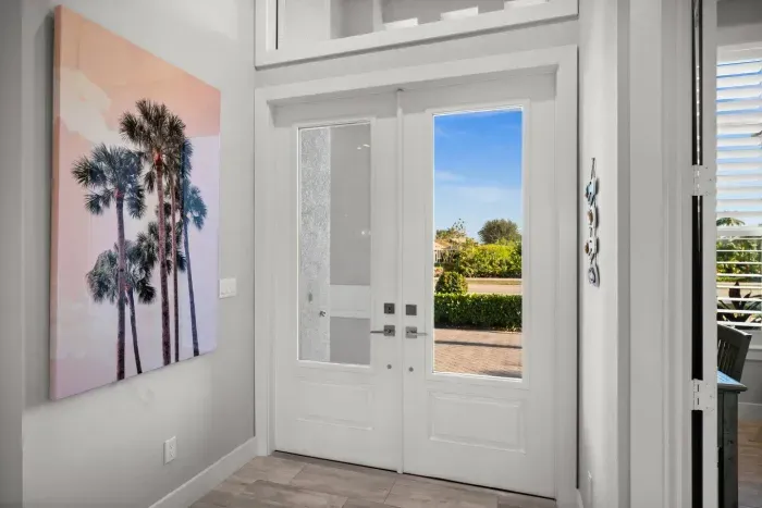Entryway: Bright, breezy entrance with palm art and views welcoming you to paradise!