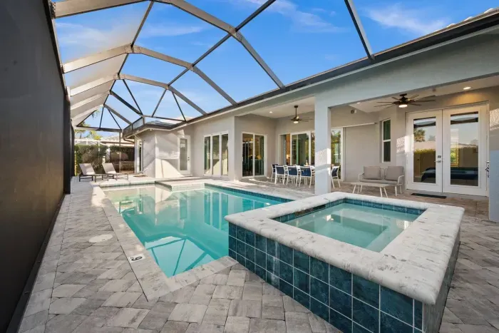 Outdoor Oasis: Dive into relaxation in this stunning pool area with sun-soaked seating!