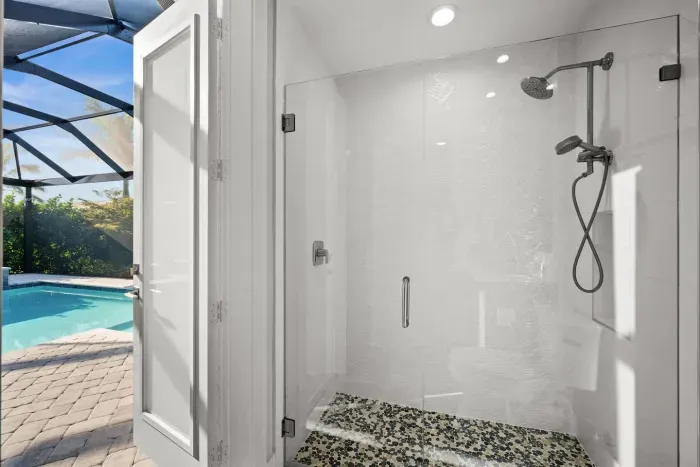 Bathroom: Sleek glass shower with tropical views—refresh and rejuvenate in style!