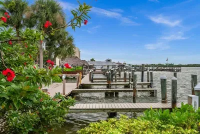 Waterfront Retreat: Enjoy panoramic views and vibrant gardens by the tranquil docks!