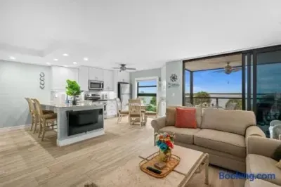 Living Room: Open layout with bay views, vibrant decor, and perfect for relaxation!