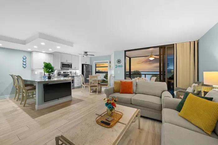 Living Room: Open layout with bay views, vibrant decor, and perfect for relaxation!