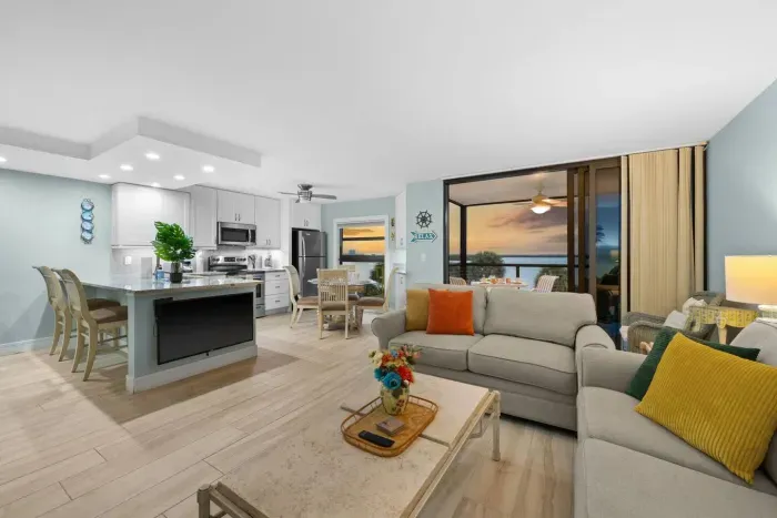 Living Room: Open layout with bay views, vibrant decor, and perfect for relaxation!