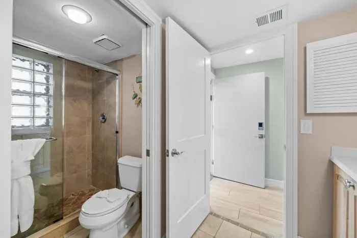Bathroom Retreat: Enjoy a chic shower surrounded by stylish tile and modern fixtures!