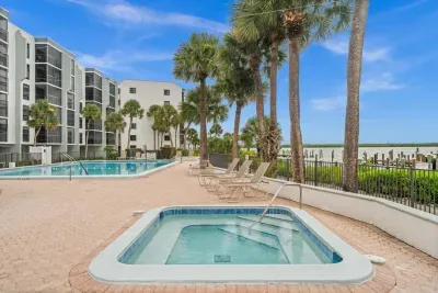 Poolside Paradise: Dive into relaxation by the lush palms and sparkling waters of your retreat!