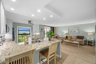 Living Room: Bright and airy space with stunning views, perfect for relaxing or entertaining!