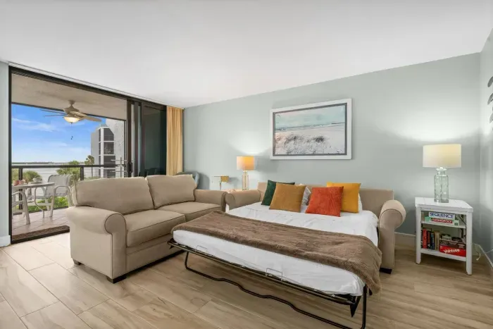 Bright living room with a comfy queen pull-out sofa bed, perfect for extra guests and family stays.