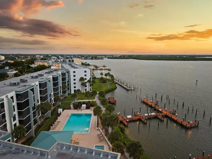 Exterior View: Breathtaking sunrise views over the bay, poolside relaxation awaits!