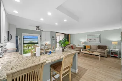 Living Room: Bright and airy space with stunning views, perfect for relaxing or entertaining!