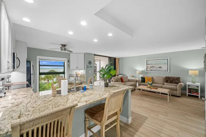 Living Room: Bright and airy space with stunning views, perfect for relaxing or entertaining!
