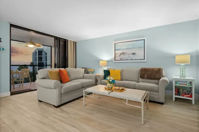 Living Room: Bright space with modern decor and stunning sunrise views, perfect for relaxation!