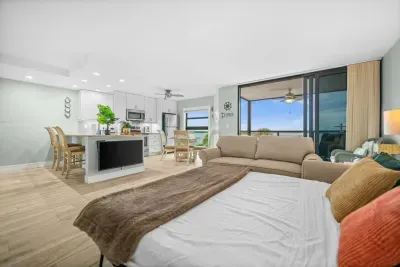 Living Room: Bright and airy space with stunning views and pull out sofa.