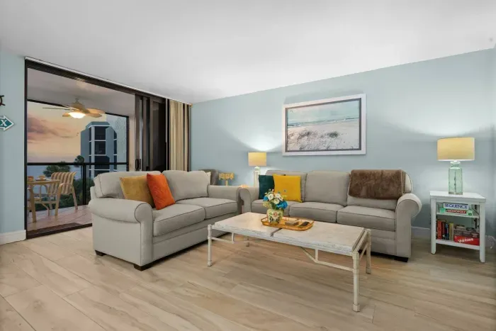 Living Room: Bright space with modern decor and stunning sunrise views, perfect for relaxation!