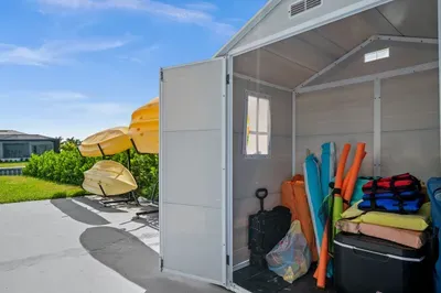 Outdoor Gear Ready: Kayaks and gear await your next seaside adventure in sunny Marco Island!