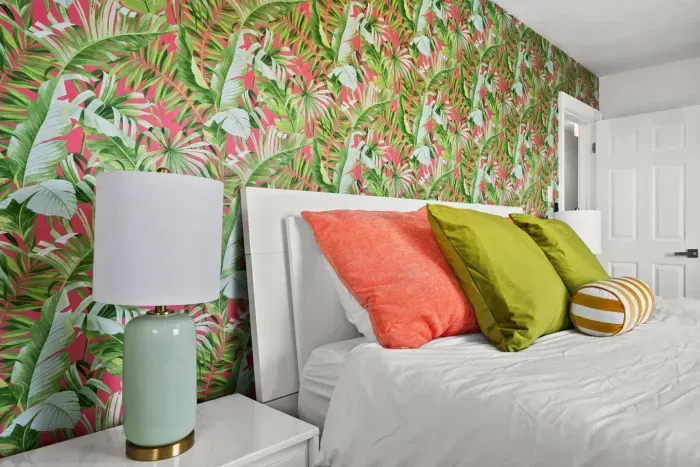 Tropical Retreat: Vibrant wall art and plush pillows create a playful, inviting atmosphere!