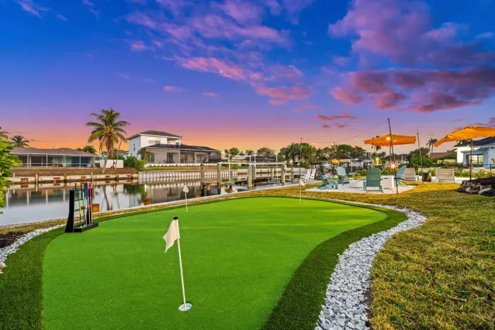 Outdoor Oasis: Enjoy stunning sunset views while practicing your putting skills by the water.