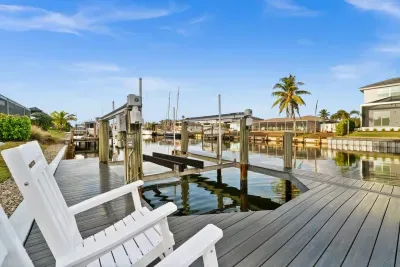 Dockside Paradise: Enjoy serene waterway views from your private seating oasis!