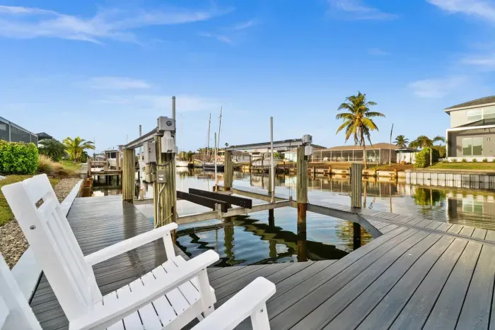 Dockside Paradise: Enjoy serene waterway views from your private seating oasis!