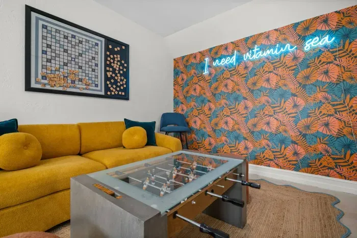 Fun Living Room: Bright colors and games invite laughter and relaxation after beach adventures!