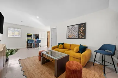 Game Room: Vibrant space with arcade games, plush seating, and a playful atmosphere!
