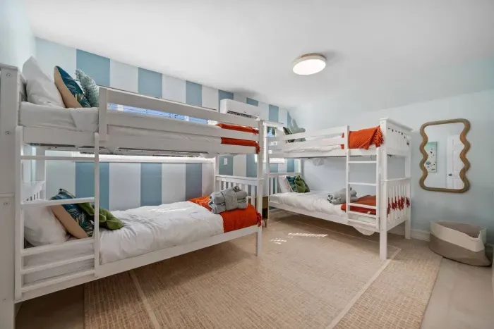 Bunk Room Delight: Fun bunk beds and bright decor create the perfect kids’ retreat!