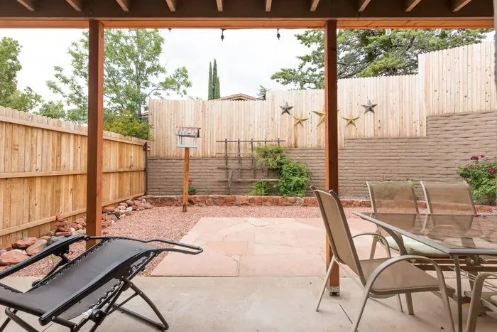 Enclosed back courtyard with seating area