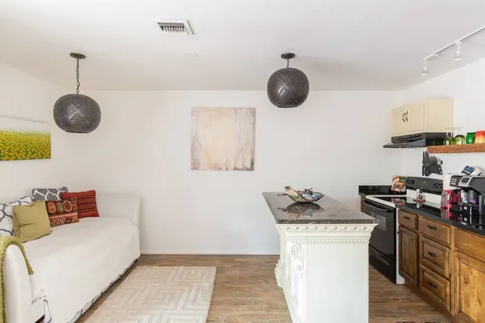 Another view of the trundle day bed and kitchen island