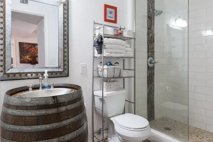 Fully stocked bathroom with barrel sink