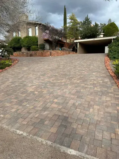 One of two entrances to front driveway w/ 2 car carport. Recently upgraded pavers as of March, 2024.