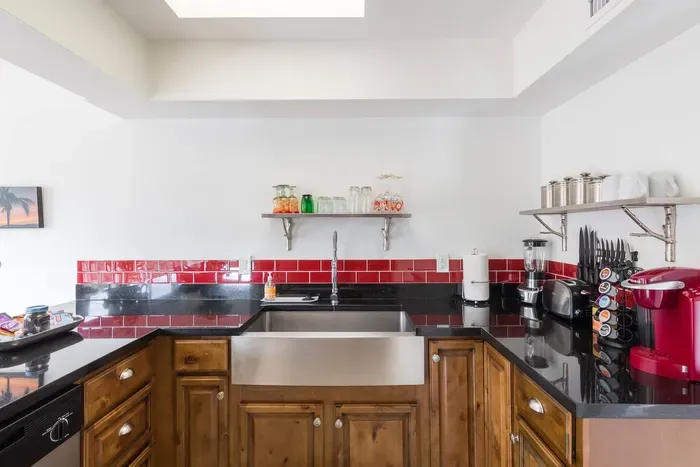 Chef’s Kitchen – Cook with ease using premium cookware, farmhouse sink, and a Keurig coffee maker.