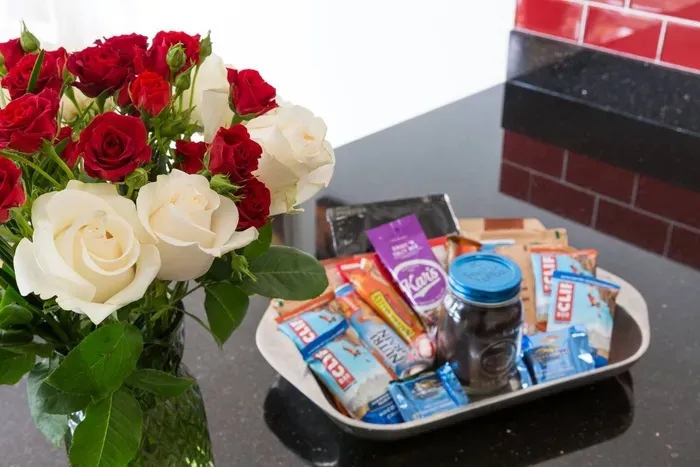 Fresh flowers, snack basket, and freshly ground coffee