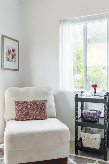Bedroom chair and nightstand with supply baskets