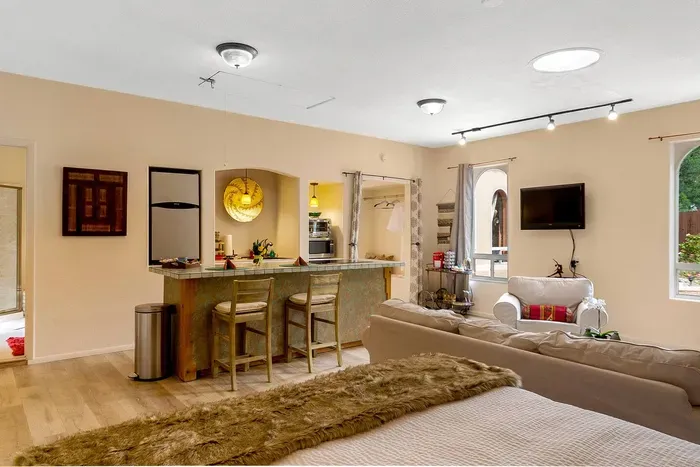 Large island, refrigerator, and small cooking area