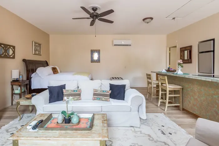 Large main living area with queen sized bed and sitting area. A perfect space for a solo traveller or couple.