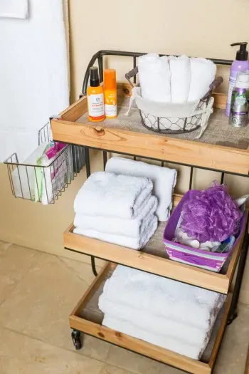 Dolly with towels and bathroom supplies