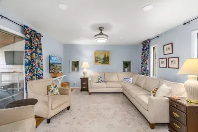 Spacious, light-filled living room with cozy seating for the whole group