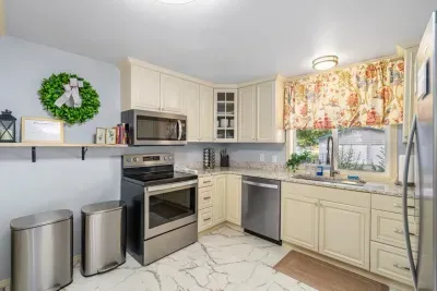 Bright updated kitchen with granite counters and stainless appliances