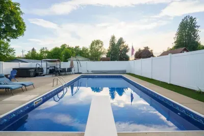Pool with diving board and ladder entry