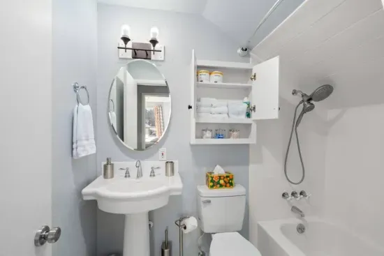 Upstairs bath: Shower-tub combination, soap bars, PooPourri spray, Neutrogena individually packaged makeup remover towelettes, cotton balls, Q-tips, shampoo, conditioner and body wash