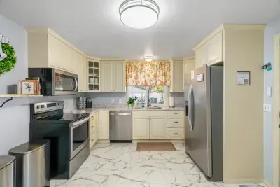Bright, roomy kitchen with stainless appliances and ample counter space